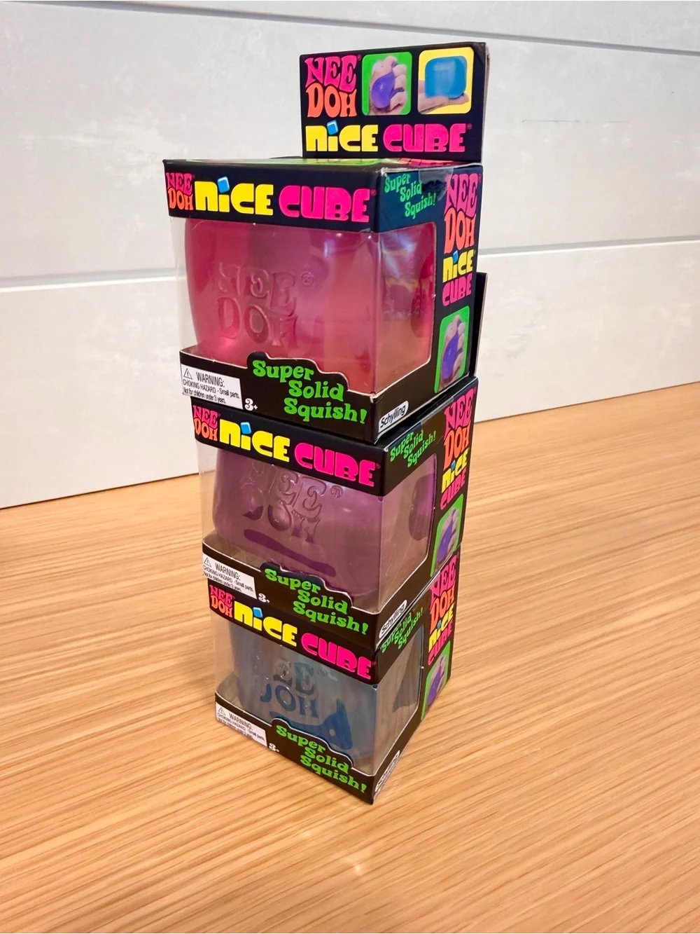 Needoh Nice Cube Squishy Blue, Pink, and Purple